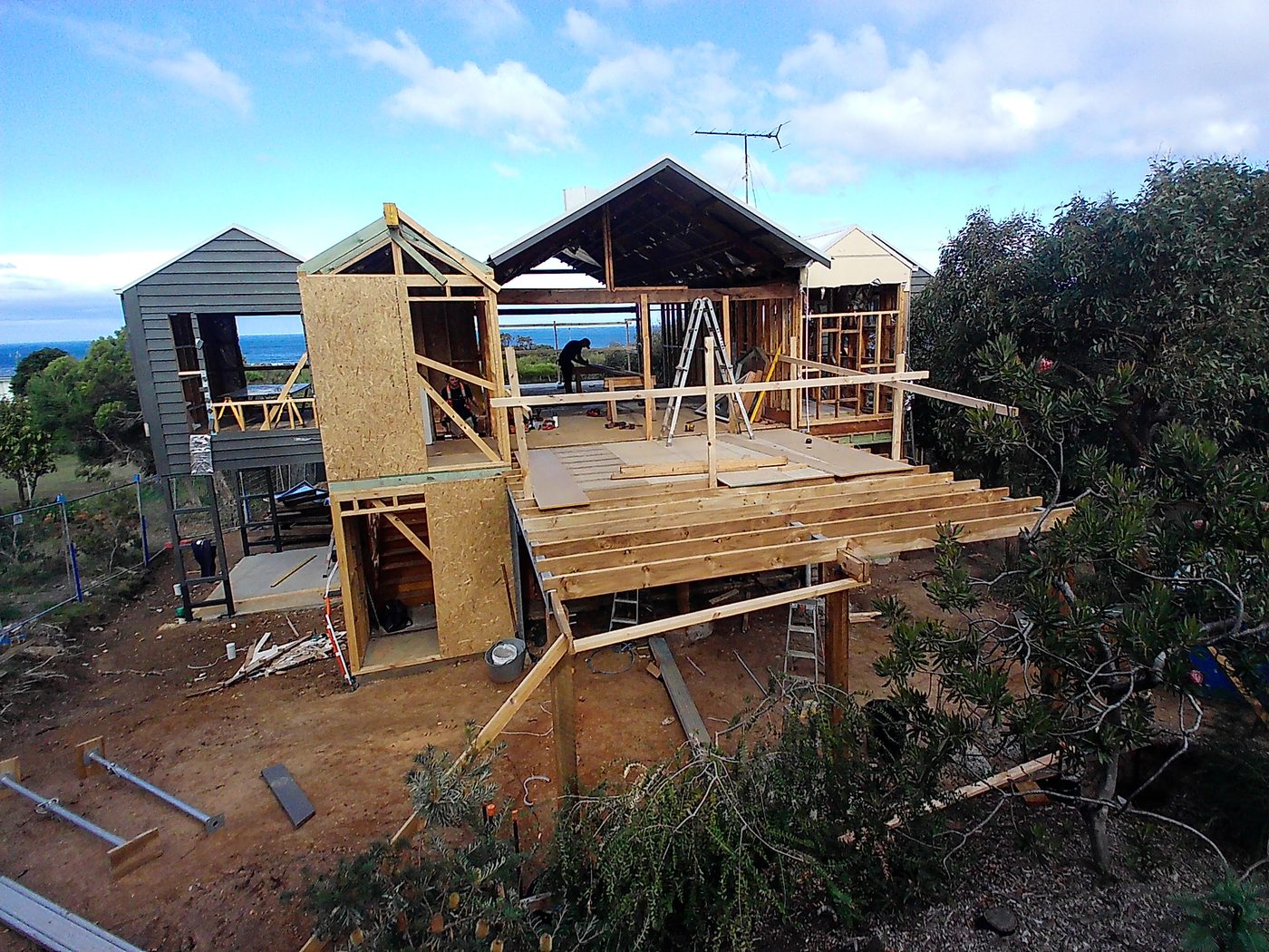 Live view of a beach house construction site captured by the Snitchy Camera app